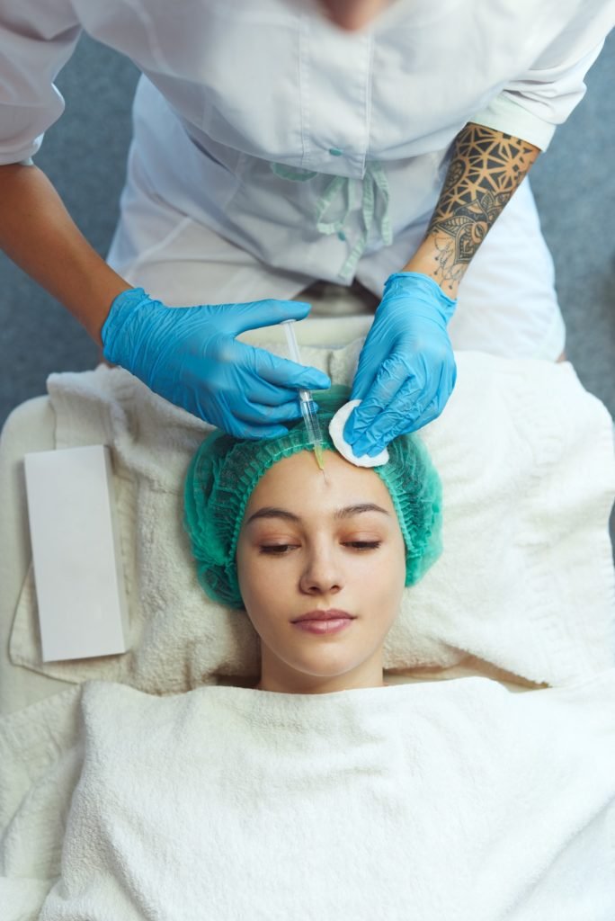 Young girl gets a cosmetic injection.