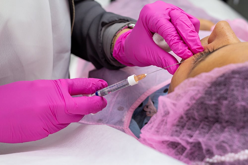 Healthcare professional participating in private aesthetic injectables mentorship training at AMEQ Academy Saint-Sauveur location